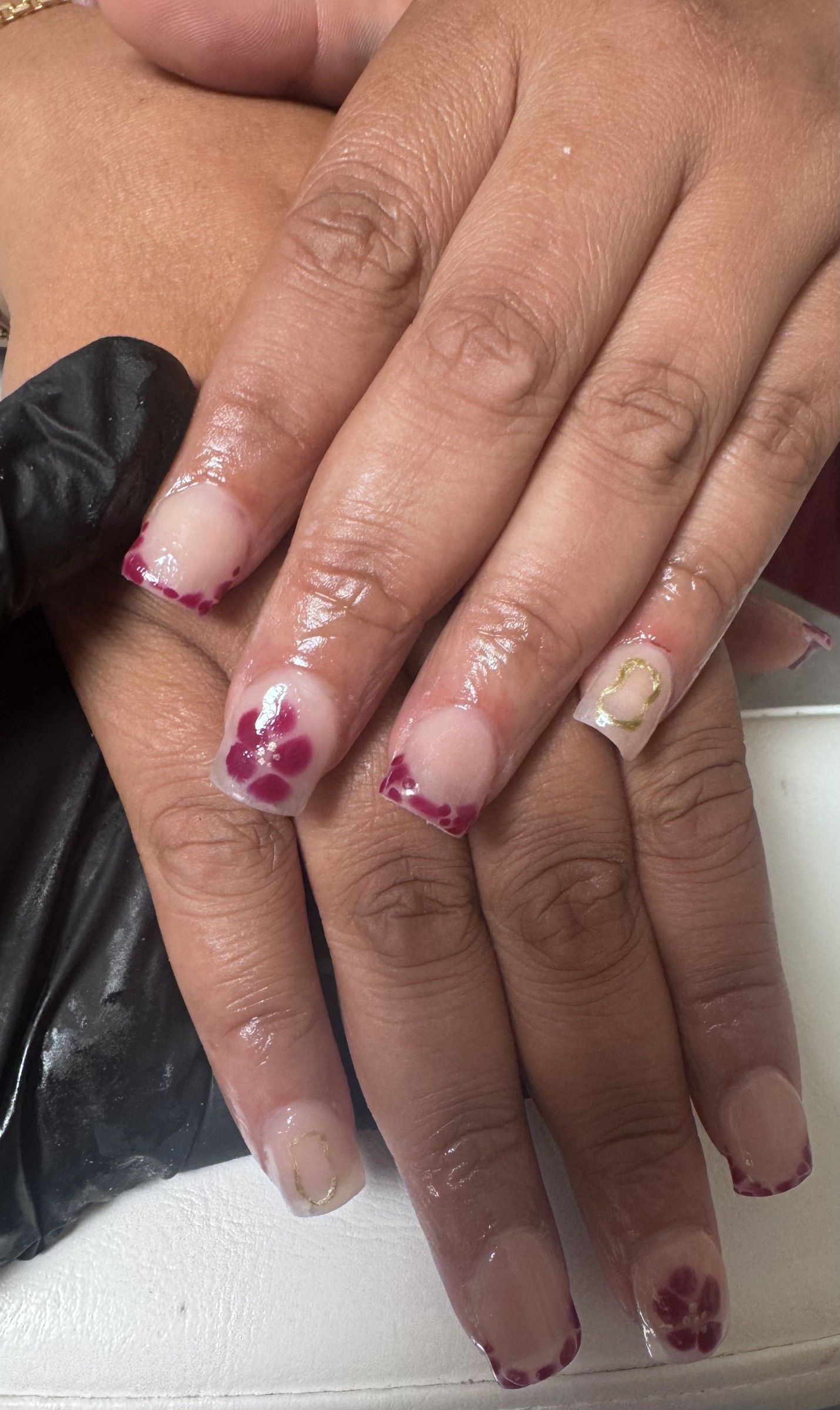 Clear acrylic nails with pink hand-painted flowers