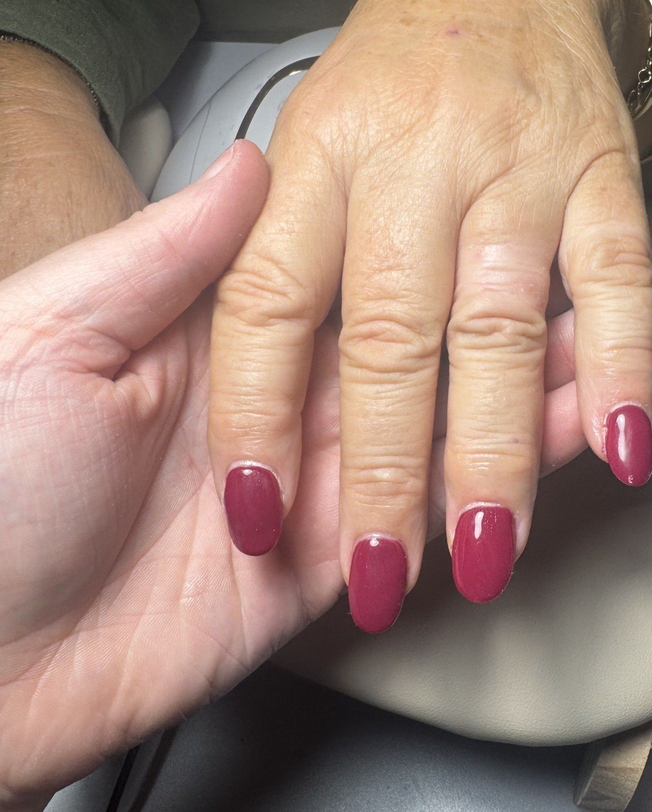 Burgundy gel polish on short rounded nails